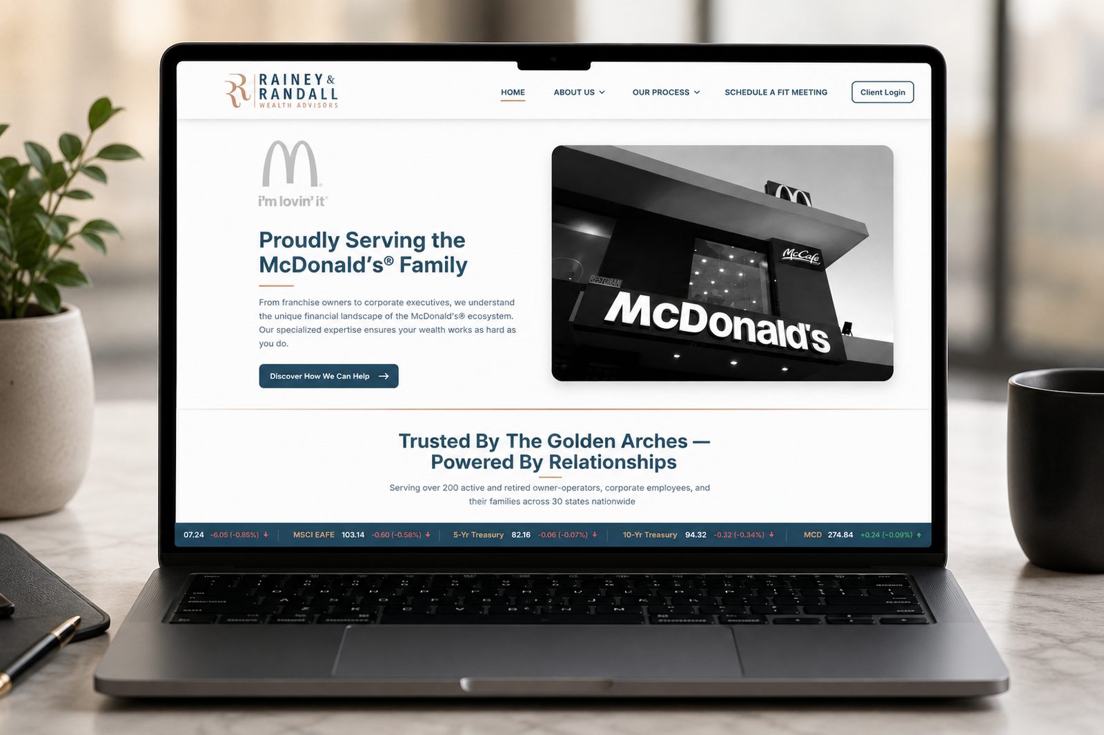Rainey & Randall Wealth Advisors website on a laptop — brand and site designed by Wealth Advisor Agency for an advisory practice serving McDonald's franchisees and corporate families.